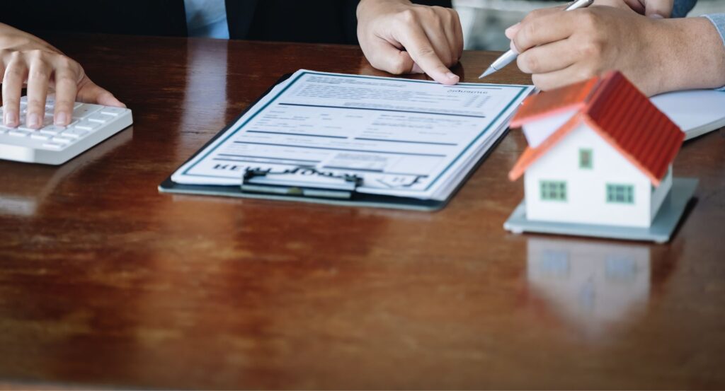 signing refinance document.